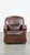 This spacious and in good condition dark sheep leather armchair/armchair with round shapes and a comfortable seat. This...