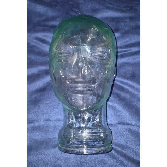 Add a touch of eclectic, retro charm to your space with this vintage mid-century molded glass mannequin head. Made from...