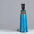 Table lamp made of partly blue-glazed stoneware with relief pattern. Signed “HA Nils Made in Denmark” on the bottom....