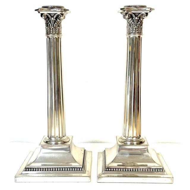 Pair of Sheffield Plated Corinthian Column Candlesticks Attributed to Elkington & Co., England, Circa 1880 This pair of...