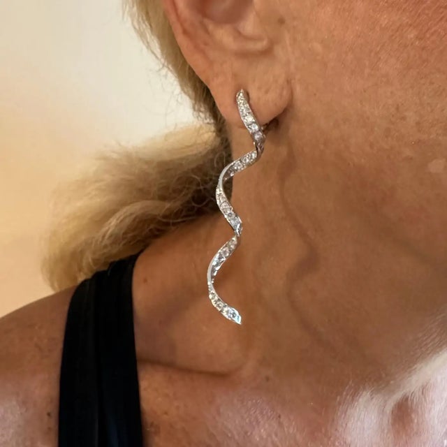 Platinum Diamond Long Twisted Hanging Drop Earrings by Harry Winston. *These earrings come with the HW pouch. **These...
