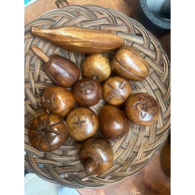 This lot of 12 MCM Monkey Pod Wooden Carved Fruit from the 1960s is a unique and handmade collectible set. Each piece is...