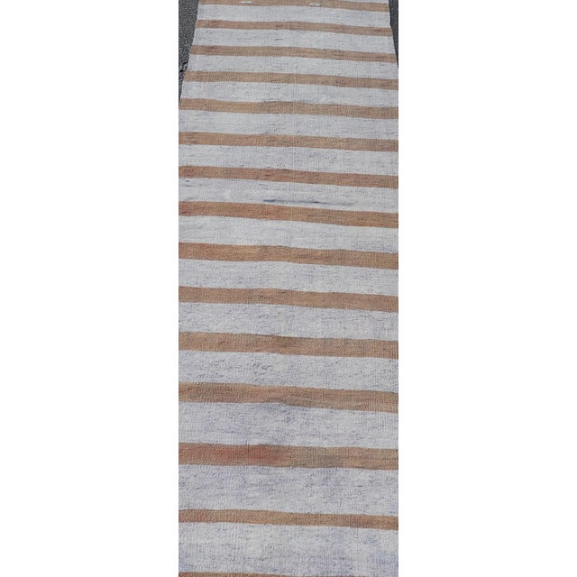 Measures: 2’6 x 8’4 Turkish Vintage Kilim Runner in Gray and Brown Stripes Keivan Woven Arts / rug / EN-179887 Country of...