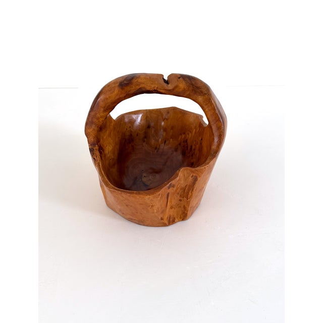 Natural burl root wood hand carved basket. Burl root wood is prized for its complex patterns and hardiness. The organic...
