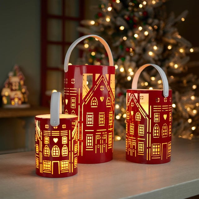 Illuminate your home with this charming Punched Metal House Lantern Set. Featuring bright red and white tones, these...