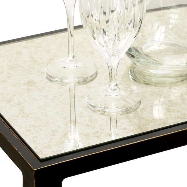 Iron console table with bronze finish, antique mirror top