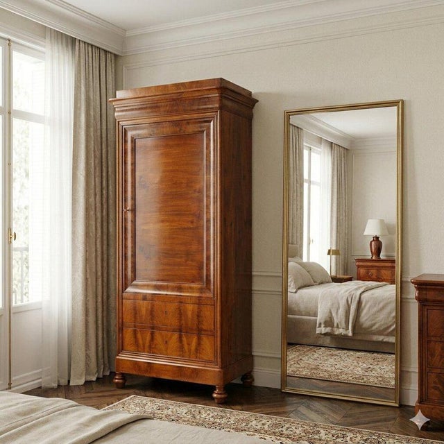 Charles X wardrobe in mahogany and mahogany crotch. Front with paneled door and two drawers underneath, three internal...