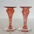 Rare midcentury hand-blown art glass candlestick holder pair in a warm pink-to-cranberry swirl. No maker’s mark allow us...