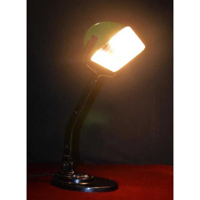 A striking belgian art deco adjustable desk lamp by sevadac, dating to circa 1920, combining early industrial...