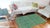 This stunning hand-knotted Afghan Balouchi rug is a captivating addition to any decor. Crafted by skilled artisans, it...