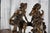 Beautifully detailed vintage figurative sculpture depicting a romantic pastoral scene featuring a young man and woman in...
