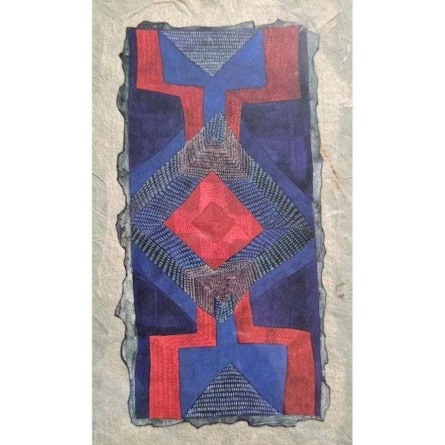 Fiber art at its most confident — color and structure working together without apologizing for either. This small framed...