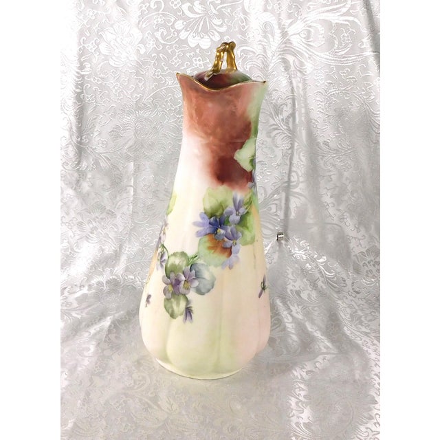 This is an unmarked, or no longer marked chocolate pot. There is a spot on the bottom that might have once been a maker’s...