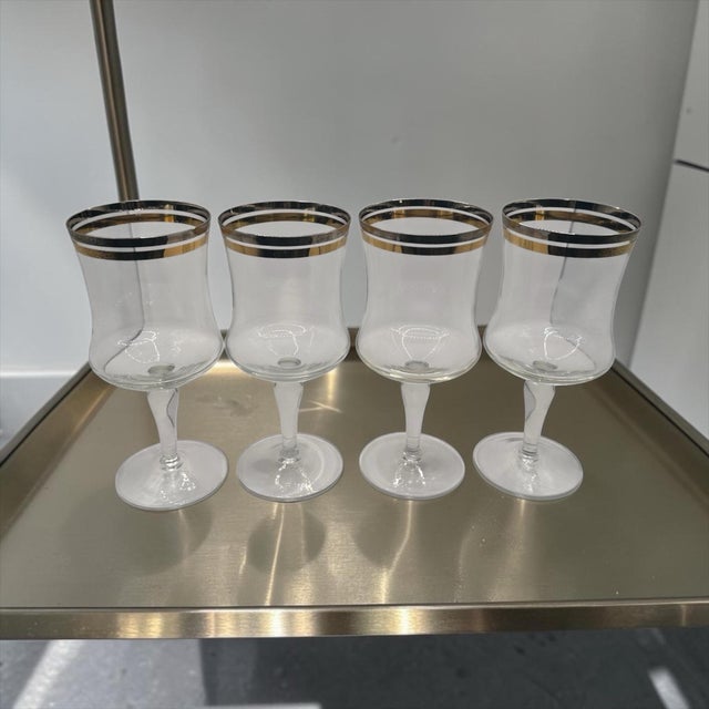 Vintage wine glasses from 1960s. Set of 2. Made by Krosno Glass S.A. Handmade in Poland. Clear glass with two bands, one...