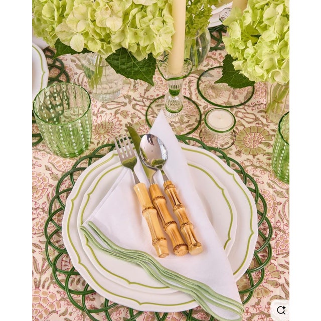 Bring a touch of tropical elegance to your table with this 12‑piece flatware set, featuring bamboo‑style handles paired...