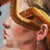 Contemporary Safe Passage by Stefan Smit | Oil Painting of a woman holding a paint roller and traffic sign. For Sale - Image 3 of 5