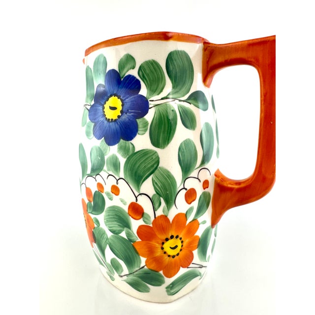 A vibrant vintage Czech pitcher marked Czechoslovakia and hand painted with bold folk art florals in saturated cobalt...