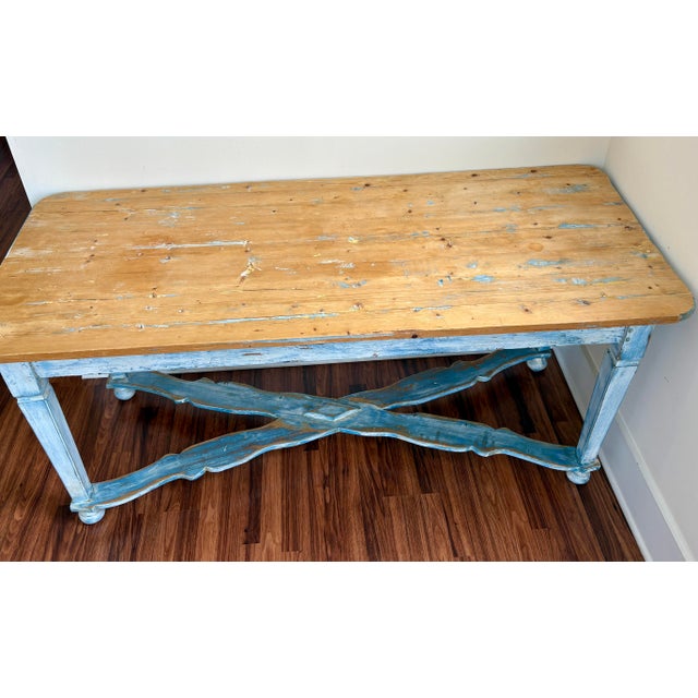 Antique Belgian farm table featuring a beautifully weathered painted base in soft blue tones paired with a warm natural...