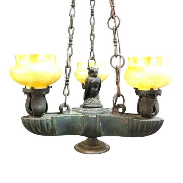 This exquisite antique chandelier, dating to approximately 1900, features a figural bronze frame consistent with the...