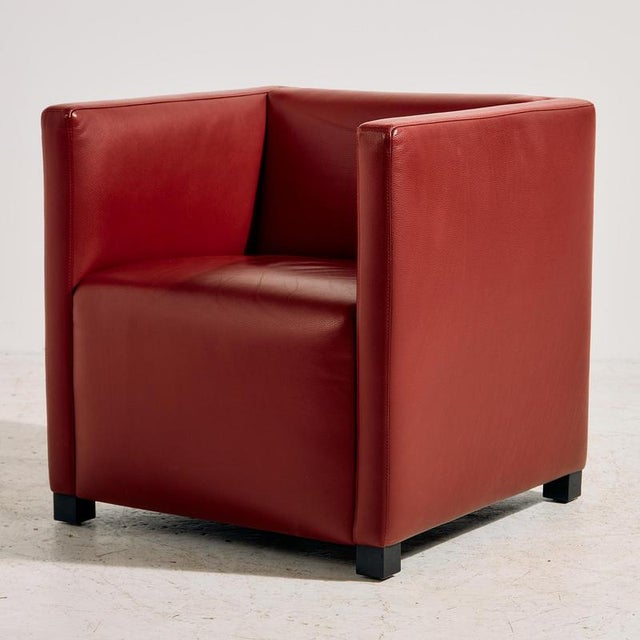 The ‘Cubic’ armchair designed by Paolo Piva for Wittmann in the 1980s. The furniture has interesting shapes, wooden legs...