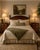 Elegant pair of vintage Chippendale-style three-drawer nightstands crafted in mahogany with mahogany veneers. Each chest...