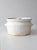 This vintage handmade studio pottery bowl has a classic casserole-style shape with a smooth white glaze. Twisted side...