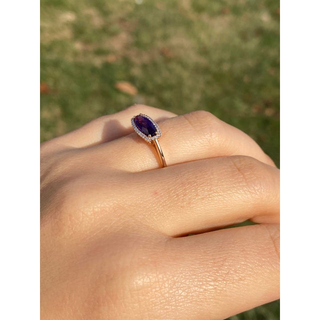 The 93rd Avenue: Contemporary Checkerboard Cut Elongated Amethyst and Natural Diamond Halo Ring in Rose Gold. This ring...