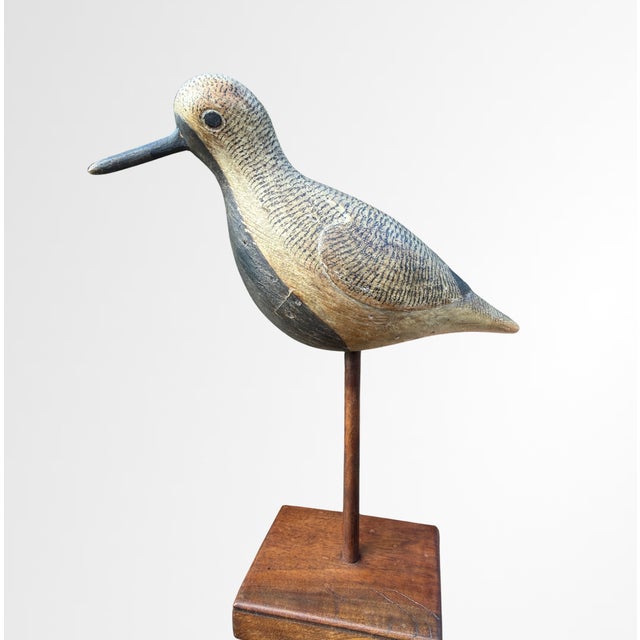 A beautifully hand-carved Black-Bellied Plover by acclaimed American bird and decoy carver Mark S. McNair. Signed on the...