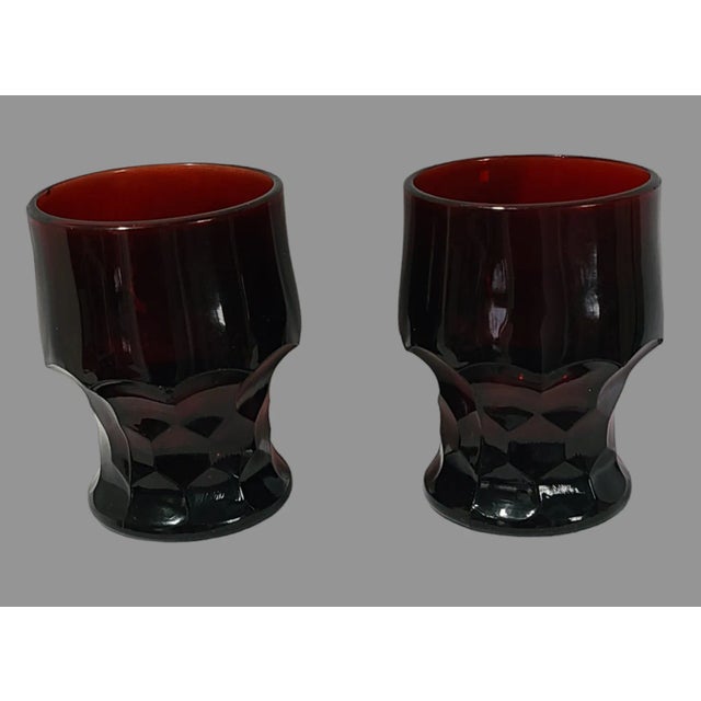 Elevate your drinkware collection with this stunning vintage pair of deep ruby red Anchor Hocking Honeycomb Georgian...