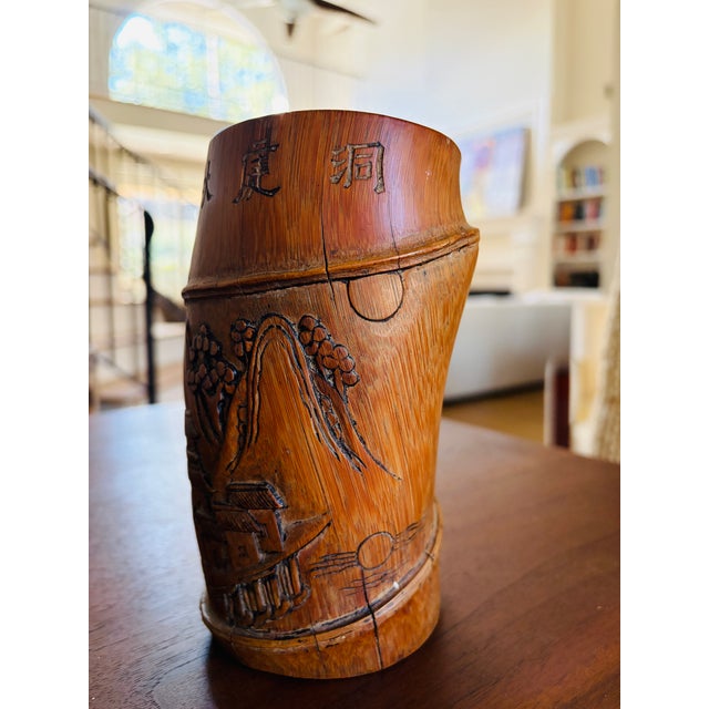 Enhance your collection with this exceptional antique Chinese carved bamboo brush pot (bitong), dating from the Late Qing...