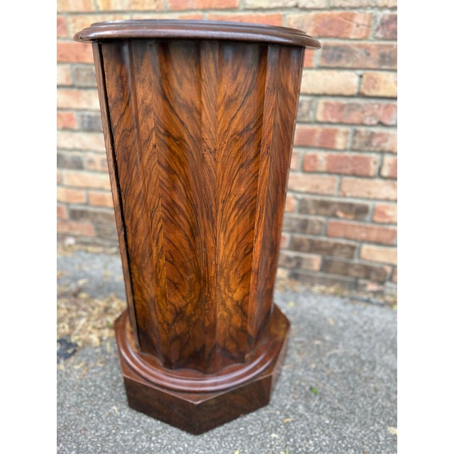 This is a stunning 19th century English stand. The natural detail in the wood is shown up splendidly by the patina...