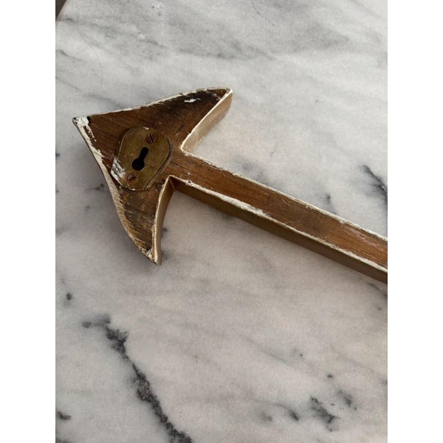 Signed ward 1967. Hand carved and painted gold wooden rooster and arrow. Lovely folk art piece for personal or retail...