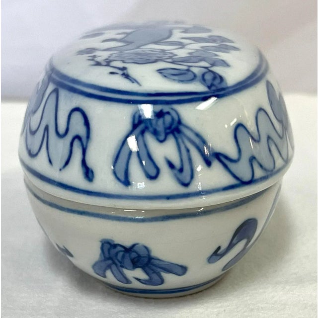 Pretty little vintage oval lidded box. It is made of porcelain and hand painted with bird and floral designs in shades of...