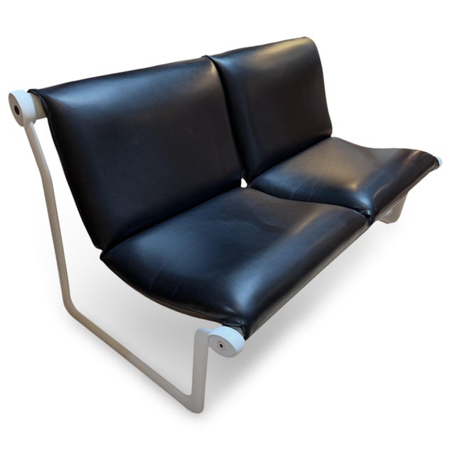 1970s Sling settee designed by Bruce Hannah and Andrew Morrison for Knoll. The settee has its original black leather...