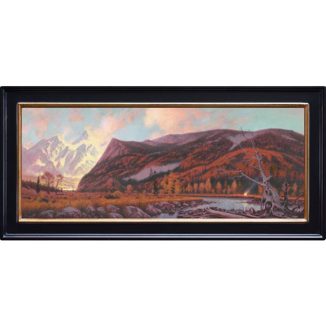 Passing Through captures a serene landscape where majestic mountains rise against a softly lit sky, their peaks bathed in...
