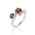 This modern ring showcases a dramatic wave-like band that cradles two warm, earthy gemstones, creating an intriguing play...