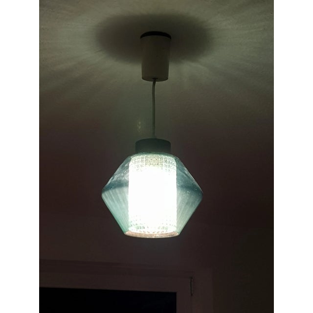 Rare Fagerlund ceiling lamp with 2 glass bodies. This model was produced in different shapes and colors. Always with a...