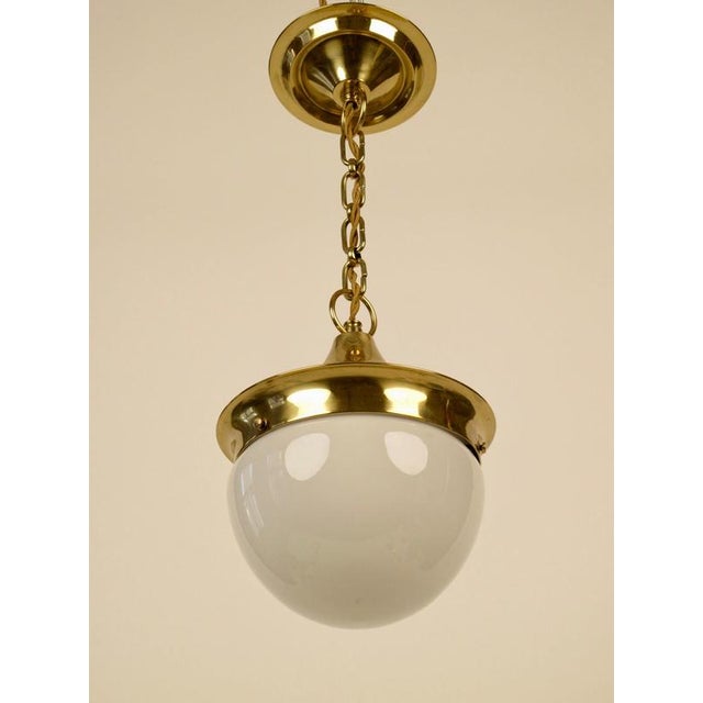A beautiful example of Viennese Late Jugendstil, This pendant lamp has been completely restored. The finish on the brass...