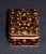 Vintage (1990's) Trinket Box is Jeweled and made of Metal. Heavy. Victorian Style. The Measurements: 2.5"W x 2"D x 1.5"H....
