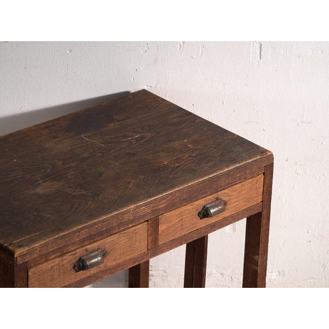 This antique Japanese console table is a writing table in wood with two drawers. It originates from Japan, from the Showa...