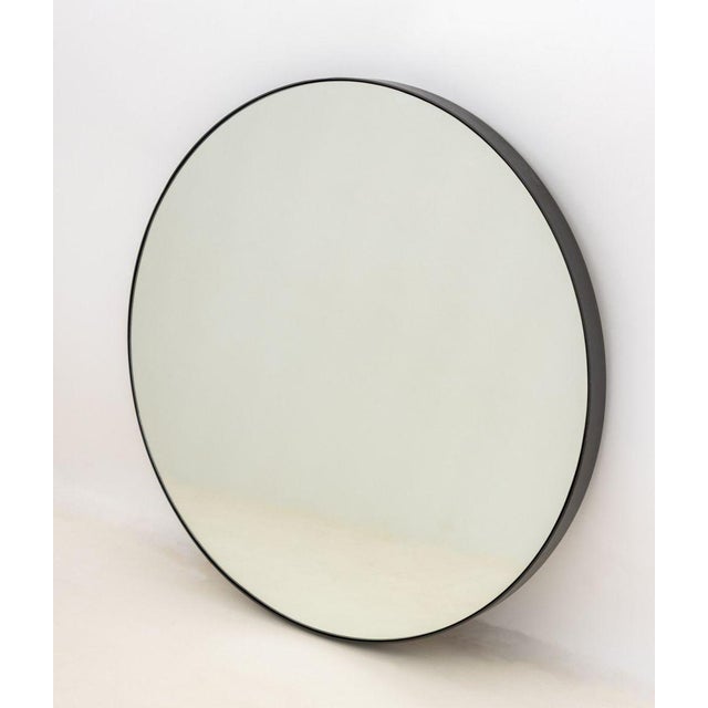 Minimalist Circular Wall Mirror, with bronzed iron frame. 36" Diameter. Provenance: From a Brooklyn Collection.