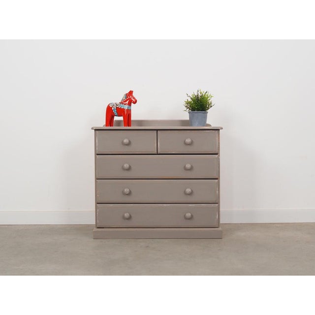 The chest of drawers was made in the 1960s, Danish production. The chest of drawers is made of solid pine wood. The...