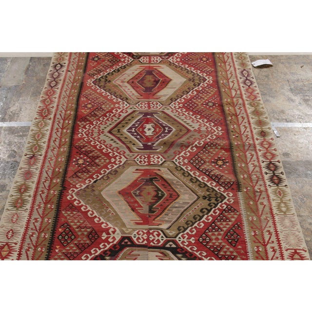 An ode to the Kayseri family of rugs, a 5x11 vintage Kilim in high-quality wool originating from Turkey between 1940-1950...