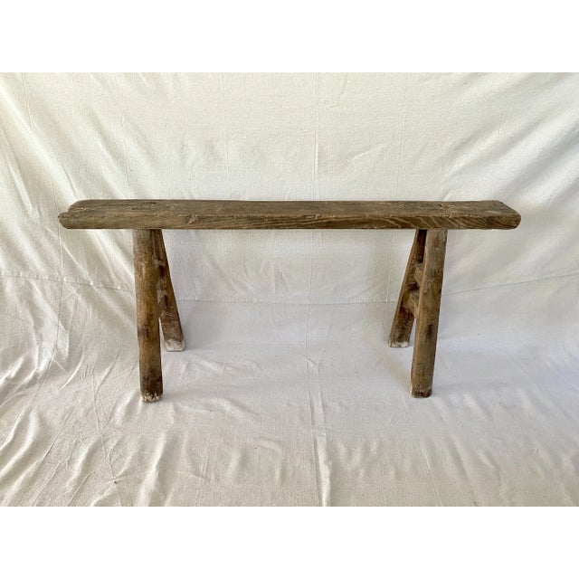 Antique handcrafted Shandong bench primitively constructed of solid elm using mortise and tenon construction. This...