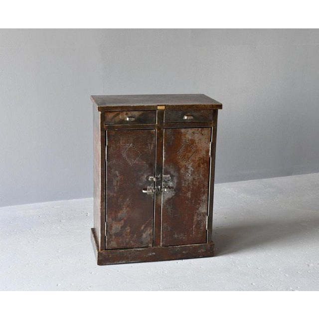 Industrial Cabinet By G Grosjean Circa 1920s Made from sheet steel with vented doors - Original handles and latches on the...