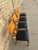 A set of four sturdy, commercial-grade bentwood chairs made by Falcon Products, Inc. Featuring a sleek, Mid-Century Modern...