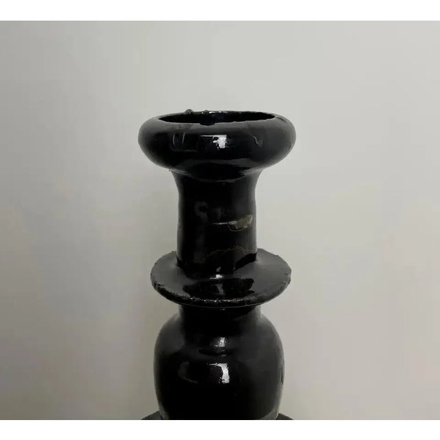 Beautiful and large Chinese altar candlestick in black enameled ceramic with brown reflections. Beautiful decorative...