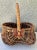 Nice vintage buttocks style basket. Natural and multicolored. Measures 10” long x 10” wide x 12” tall. Basket is 5” deep.