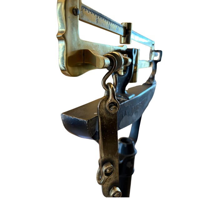 An authentic early 20th-century physician’s balance beam scale by the Fairbanks Scale Company, a premier American maker...