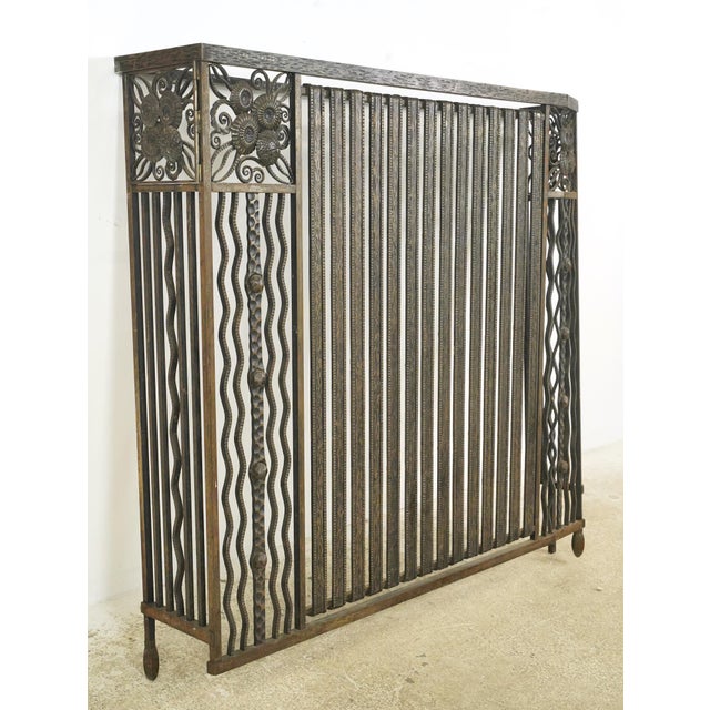 Vintage French wrought iron Art Deco style radiator cover with a bronze and black finish. Good condition with surface wear...